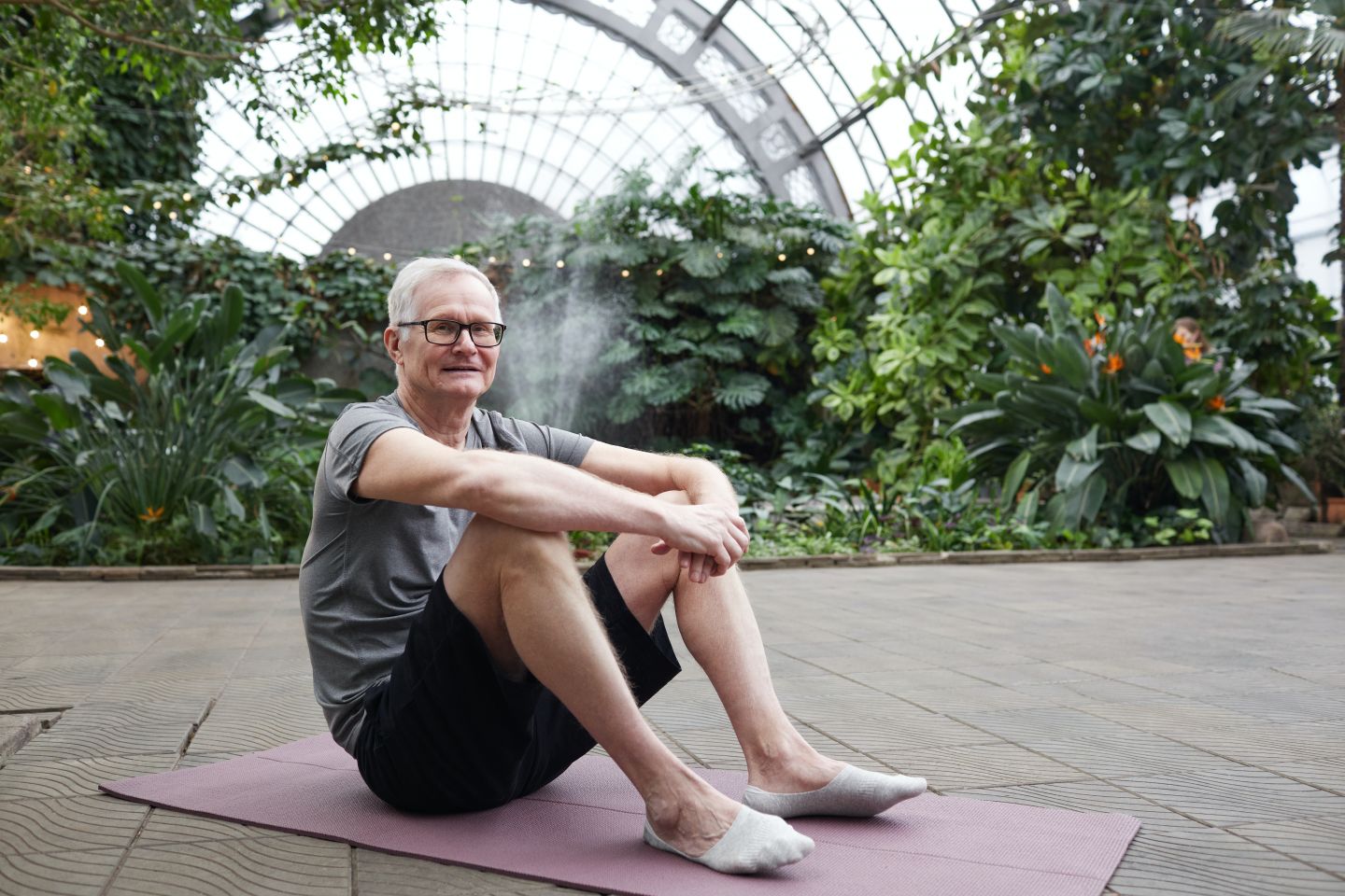 older man doing yoga